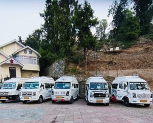 Group of people enjoying a comfortable journey in the spacious Tempo Traveller, provided by Bawa Taxi Services, the best taxi service.