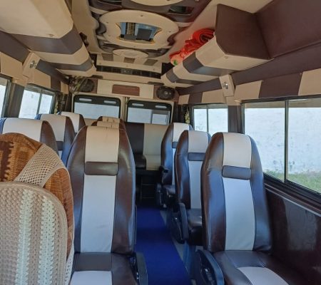 Interior view of the spacious and comfortable Tempo Traveller, available for group travel and family trips with the best service in Chandigarh.
